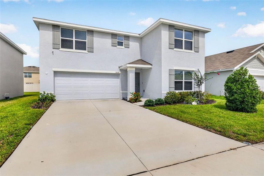 Front exterior of a new home in , Tampa, FL, highlighting curb appeal (Image 26).