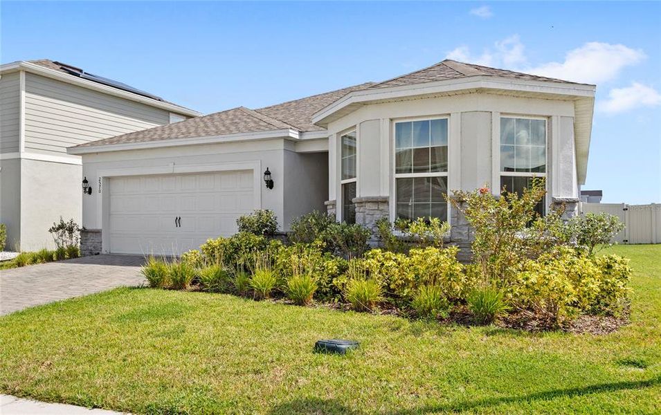 Front exterior of a new home in , Kissimmee, FL, highlighting curb appeal (Image 20). Front exterior of a new home in , Kissimmee, FL, highlighting curb appeal (Image 20).