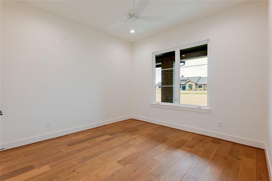 Empty room featuring light wood finished floors, recessed lighting, and ceiling fan