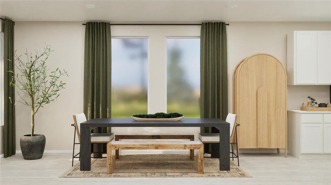 Dining space with light wood-style flooring