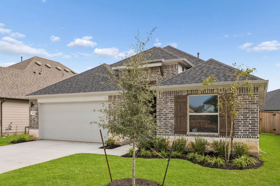 Front exterior of a new home in Riviera Pines, Huffman, TX, highlighting curb appeal (Image 17).