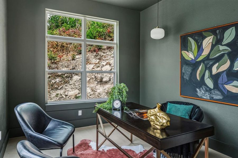 Office area featuring baseboards