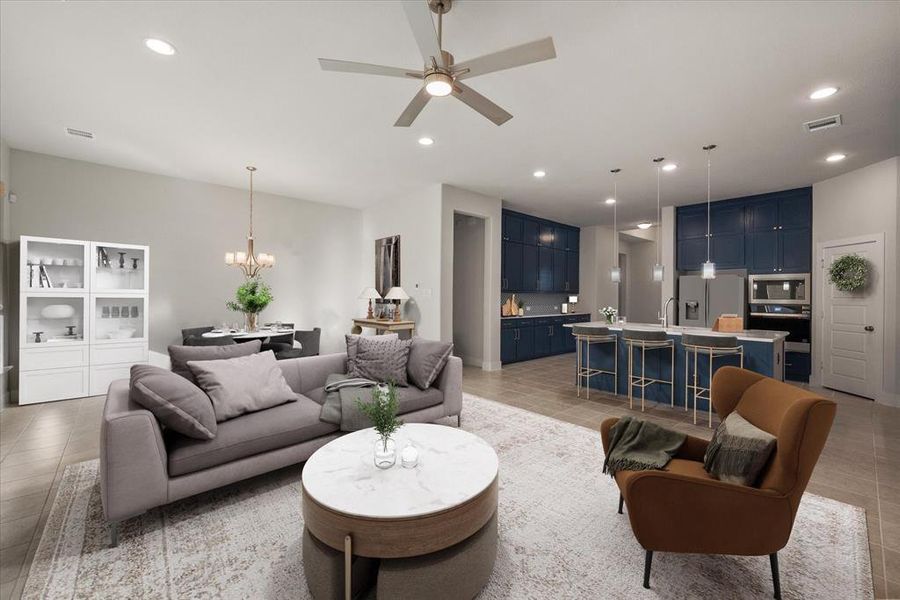 Living area is also open to the dining area and both feature tile floors.  (Photo has been virtually staged)