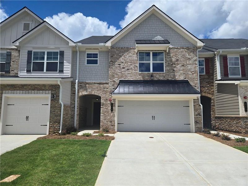 Front exterior of a new home in Park View Reserve, Mableton, GA, highlighting curb appeal (Image 2). Front exterior of a new home in Park View Reserve, Mableton, GA, highlighting curb appeal (Image 2).
