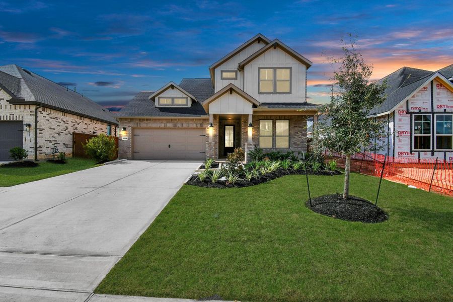 Front exterior of a new home in Elyson, Katy, TX, highlighting curb appeal (Image 2). Front exterior of a new home in Elyson, Katy, TX, highlighting curb appeal (Image 2).