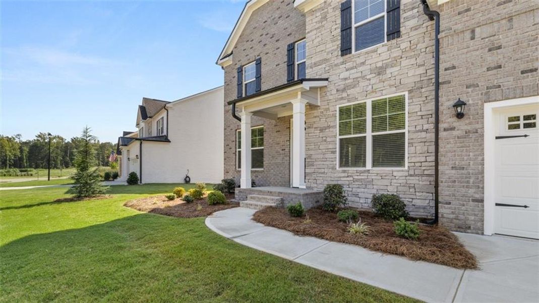 Front exterior of a new home in Westland, Bogart, GA, highlighting curb appeal (Image 2). Front exterior of a new home in Westland, Bogart, GA, highlighting curb appeal (Image 2).