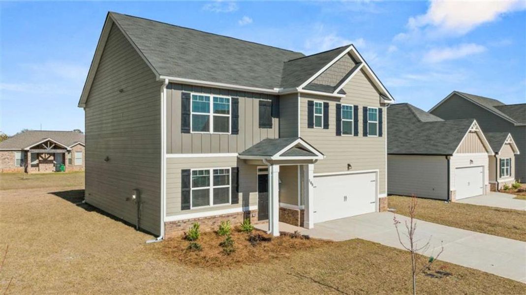 Front exterior of a new home in The Preserve at Agricultural Village, Perry, GA, highlighting curb appeal (Image 1).