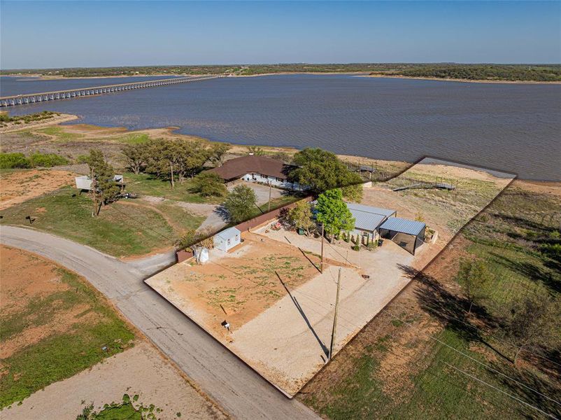 Aerial view of a large body of water and a notable bridge Aerial view of a large body of water and a notable bridge