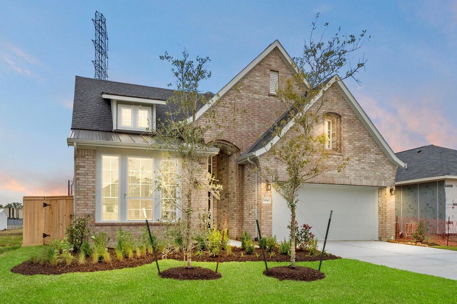 Front exterior of a new home in Mulberry Farms, Santa Fe, TX, highlighting curb appeal (Image 19). Front exterior of a new home in Mulberry Farms, Santa Fe, TX, highlighting curb appeal (Image 19).