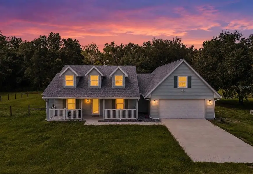 Front exterior of a new home in , Webster, FL, highlighting curb appeal (Image 24).