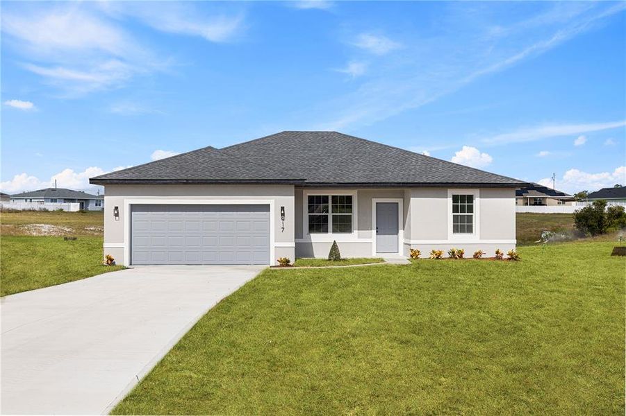 Front exterior of a new home in , Poinciana, FL, highlighting curb appeal (Image 1). Front exterior of a new home in , Poinciana, FL, highlighting curb appeal (Image 1).