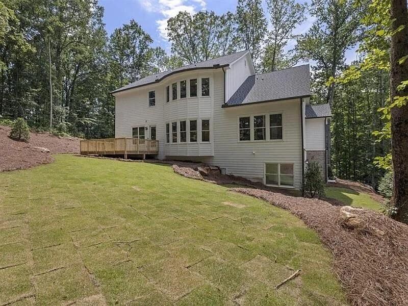 Front exterior of a new home in , Woodstock, GA, highlighting curb appeal (Image 27).