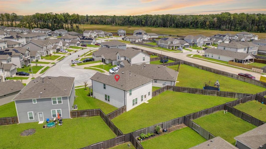 Aerial view showcasing the home's ideal location within the Pine Grove community!