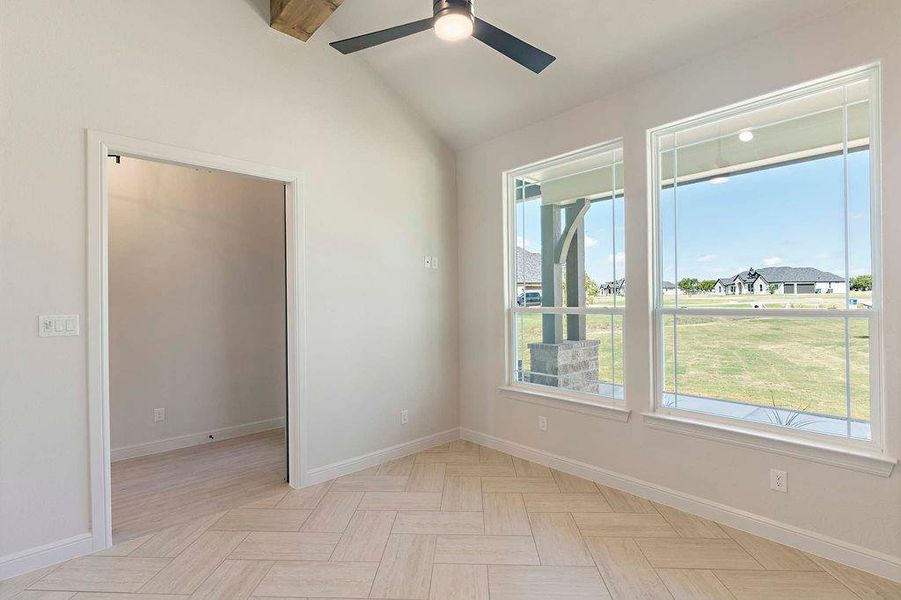 Spare room featuring ceiling fan and a residential view