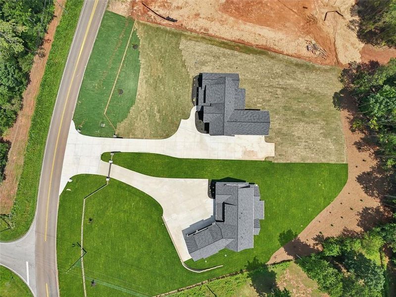 Front exterior of a new home in , Braselton, GA, highlighting curb appeal (Image 43). Front exterior of a new home in , Braselton, GA, highlighting curb appeal (Image 43).