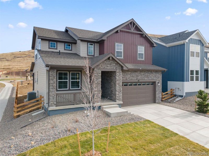 Front exterior of a new home in The Manors Collection at Golden Overlook, Golden, CO, highlighting curb appeal (Image 24).