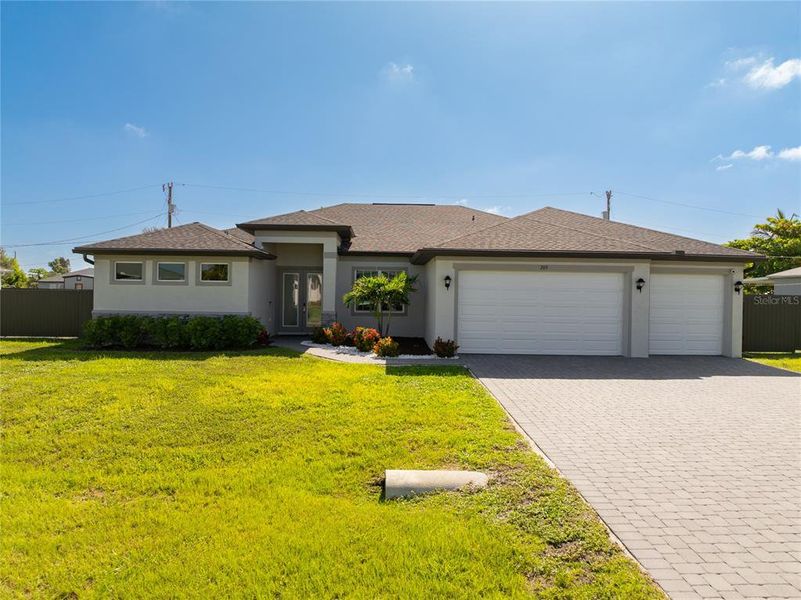 Front exterior of a new home in , Cape Coral, FL, highlighting curb appeal (Image 19).