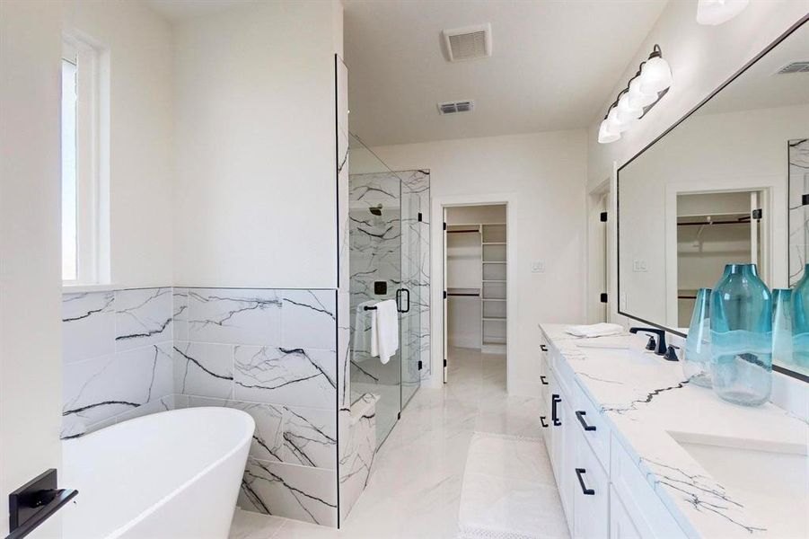 Bathroom with separate shower and tub, vanity, and tile walls