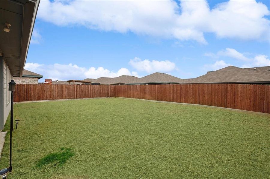 View of yard featuring a fenced backyard
