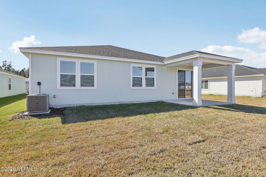Exterior details and patio area of a home in Lakes at Bella Lago - Signature Series, Green Cove Springs (Image 4).