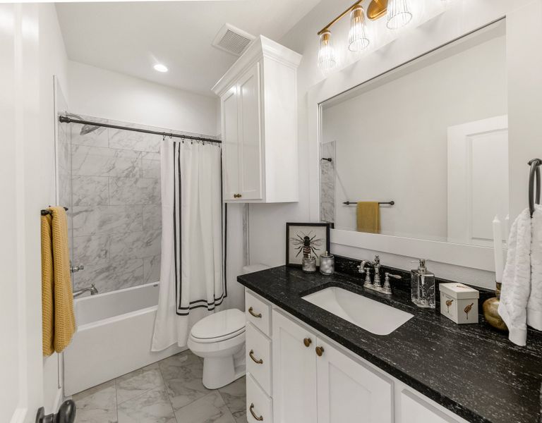 Representative furnished interior of a home built from the The Grayson by Reece Homes in Stella Ranch, Bryan (Image 29).