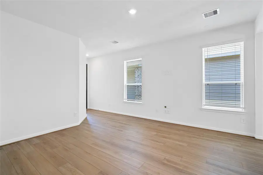 This bright and airy Great Room offers a spacious layout ideal for both relaxing evenings and lively gatherings. Designed for comfort and connection, it features Bandera vinyl plank flooring in French Oak, large windows with blinds, high ceilings, recessed lighting, and seamless access to the stunning kitchen—perfect for everyday living and entertaining alike. This bright and airy Great Room offers a spacious layout ideal for both relaxing evenings and lively gatherings. Designed for comfort and connection, it features Bandera vinyl plank flooring in French Oak, large windows with blinds, high ceilings, recessed lighting, and seamless access to the stunning kitchen—perfect for everyday living and entertaining alike.