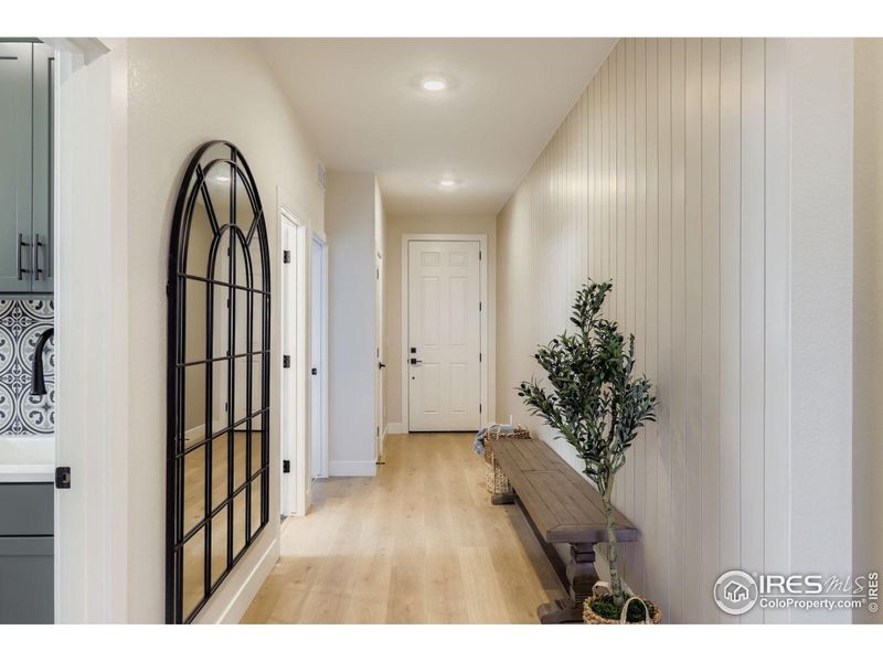 Grand and wide hall way. Shiplap wall design.