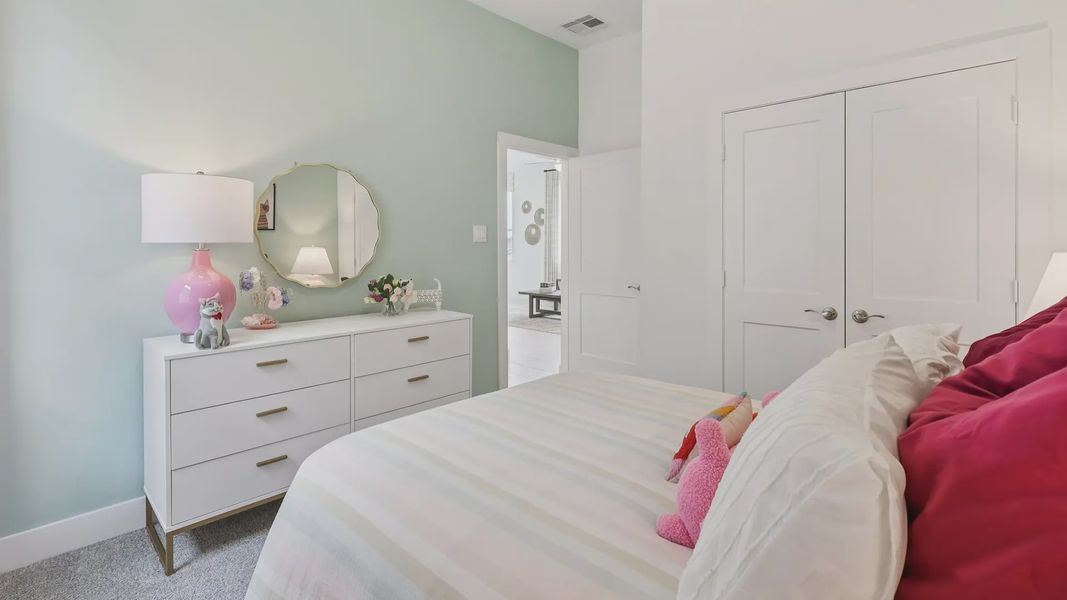 Representative furnished interior of a home built from the Adele by Chesmar Homes in Sunterra, Katy (Image 23).