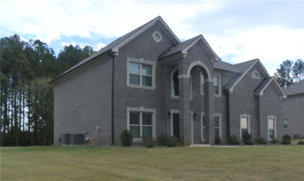 Front exterior of a new home in , Covington, GA, highlighting curb appeal (Image 1). Front exterior of a new home in , Covington, GA, highlighting curb appeal (Image 1).