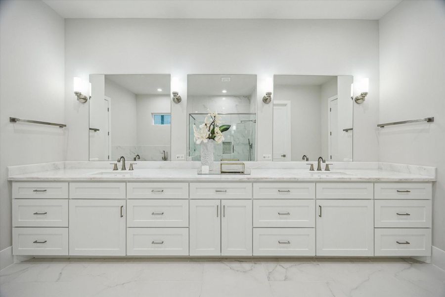 Primary bath - features an expansive marble countertop and double sinks. Primary bath - features an expansive marble countertop and double sinks.