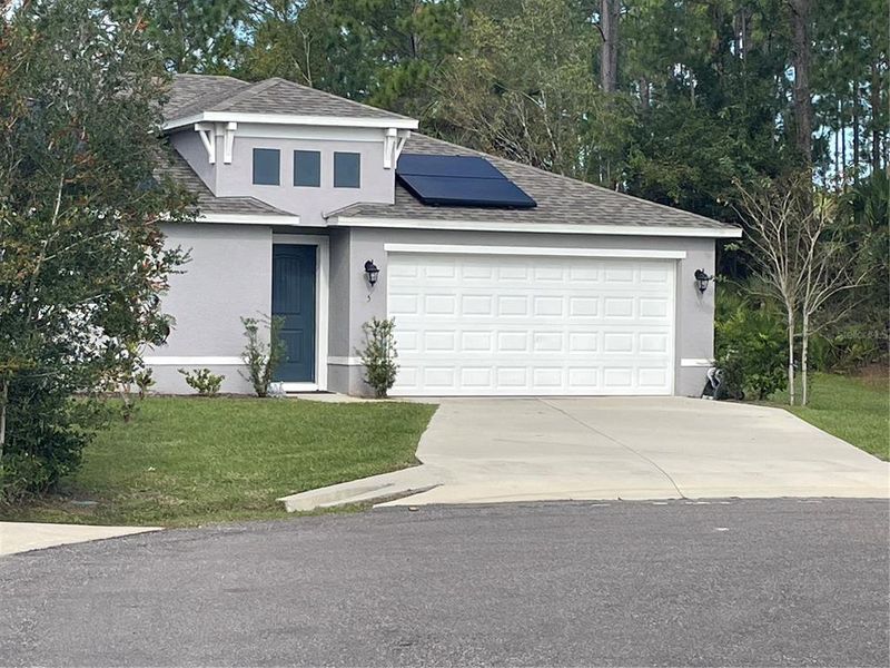 Front exterior of a new home in , Palm Coast, FL, highlighting curb appeal (Image 1). Front exterior of a new home in , Palm Coast, FL, highlighting curb appeal (Image 1).
