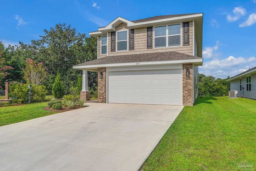 Front exterior of a new home in Allison Acres, Cantonment, FL, highlighting curb appeal (Image 22). Front exterior of a new home in Allison Acres, Cantonment, FL, highlighting curb appeal (Image 22).