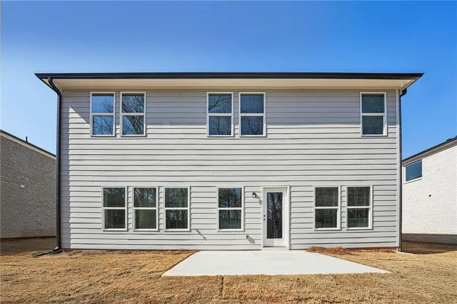 Exterior details and patio area of a home in Creekside at Oxford Park, Fairburn (Image 3).