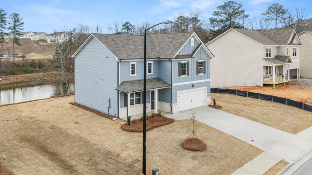 Front exterior of a new home in Thompson Ridge, Dallas, GA, highlighting curb appeal (Image 15).