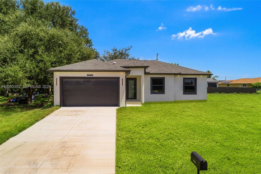 Front exterior of a new home in , Cape Coral, FL, highlighting curb appeal (Image 19). Front exterior of a new home in , Cape Coral, FL, highlighting curb appeal (Image 19).