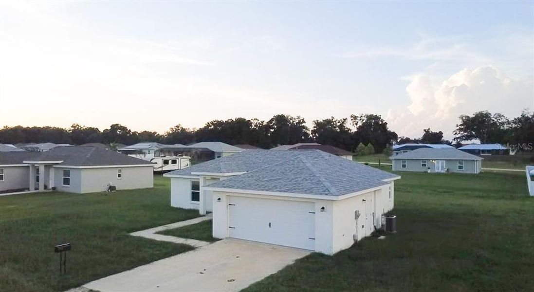 Front exterior of a new home in , Inverness, FL, highlighting curb appeal (Image 17).