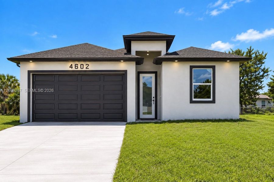 Front exterior of a new home in , Lehigh Acres, FL, highlighting curb appeal (Image 16).