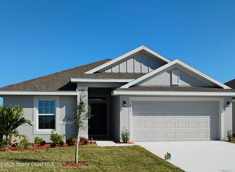 Front exterior of a new home in St. John Preserve, Palm Bay, FL, highlighting curb appeal (Image 1). Front exterior of a new home in St. John Preserve, Palm Bay, FL, highlighting curb appeal (Image 1).