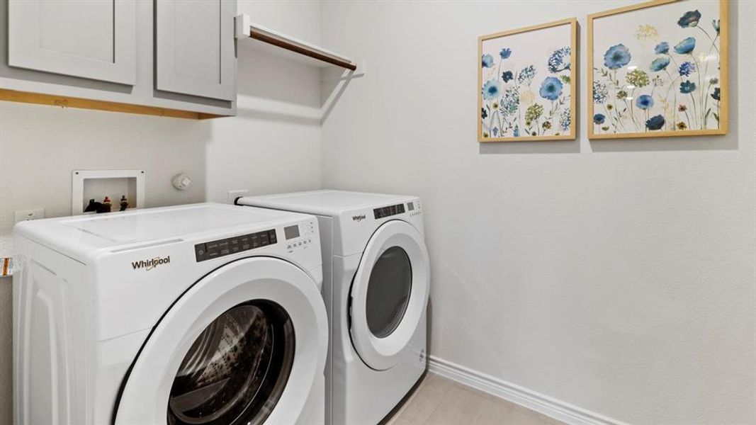 Laundry room with cabinet space and washing machine and dryer