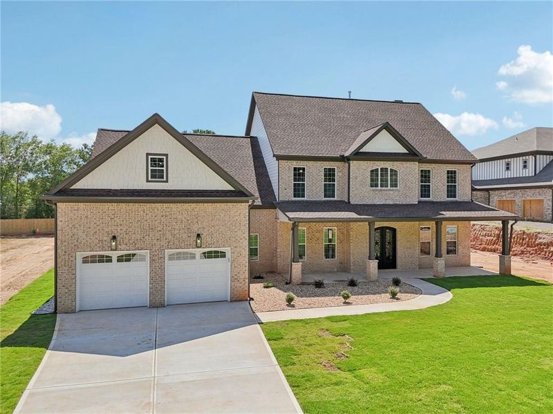 Front exterior of a new home in , Lilburn, GA, highlighting curb appeal (Image 35).