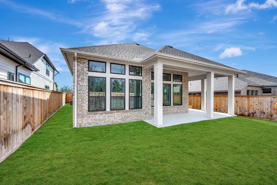 Exterior details and patio area of a home in Kresston - Enclave Collection, Magnolia (Image 26).
