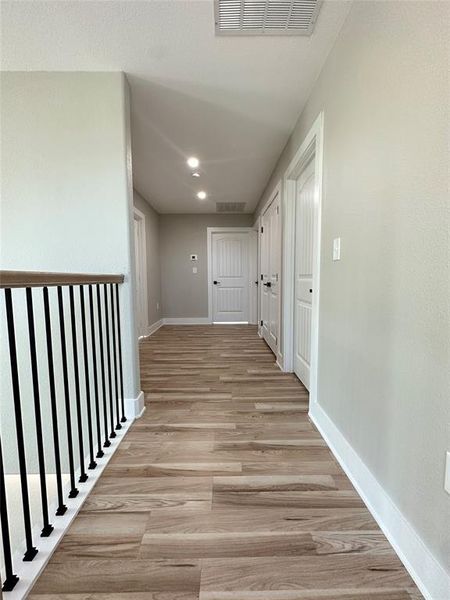 Hallway featuring light wood-type flooring