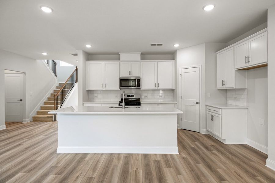 Representative furnished interior of a home built from the Charlton by UnionMain Homes in Austin Springs, Bethlehem (Image 6).