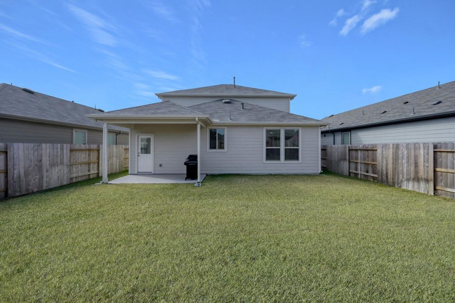 Exterior details and patio area of a home in Mavera, Conroe (Image 27).