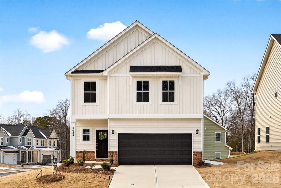 Front exterior of a new home in , Charlotte, NC, highlighting curb appeal (Image 1). Front exterior of a new home in , Charlotte, NC, highlighting curb appeal (Image 1).
