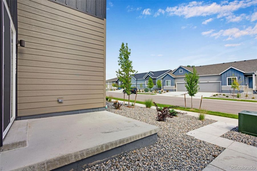 Front exterior of a new home in , Berthoud, CO, highlighting curb appeal (Image 23).