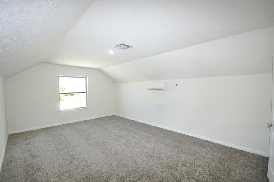 Front room which is over the porte cohere of garage 1.