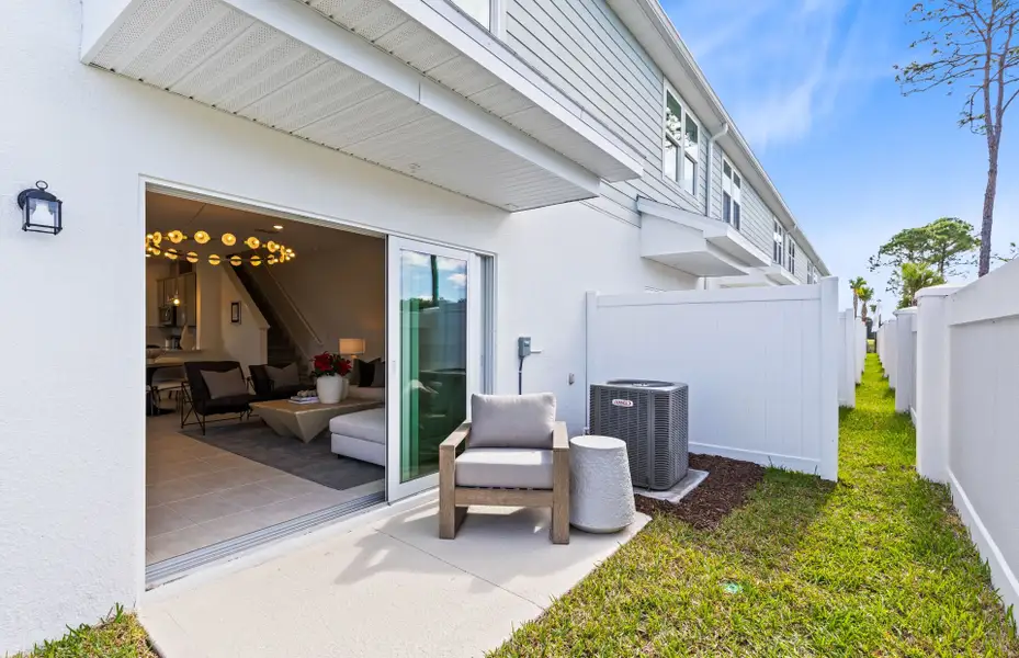 Exterior details and patio area of a home in Harbor Square, Palm Bay (Image 3).