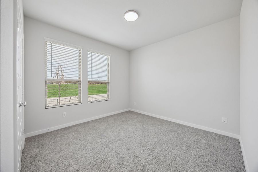 Bedroom in the Masters home plan by Trophy Signature Homes – REPRESENTATIVE PHOTO