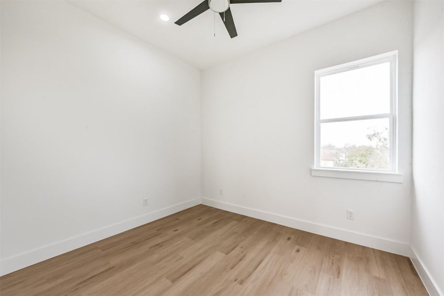 Across from the stairs is the third secondary bedroom.